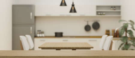 Empty space on wooden board or tabletop for montage on blurred minimalist kitchen and dining room interior in the background. 3d rendering, 3d illustrationの写真素材