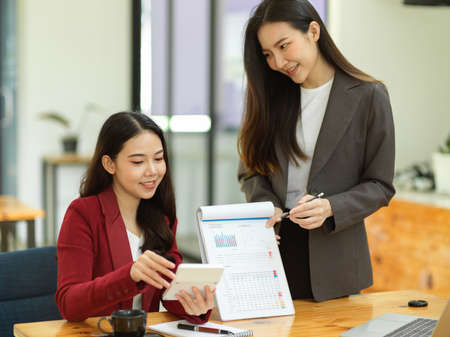 Team of Business analysts or accountants calculate and review financial data sheets in the meeting.の写真素材