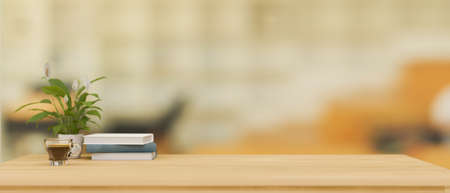 Wooden study table or worktable with books, coffee cup, plant and mockup space for montage over...
