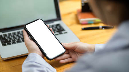 Close-up Female assistant using modern smart mobile phone to shopping online, using application, message.の写真素材