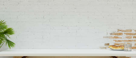 Close-up Copy space on white table top for montage product display with bread and water over white...