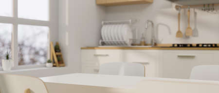Modern contemporary dinning room with space for montage on modern dining table and cooking space in...