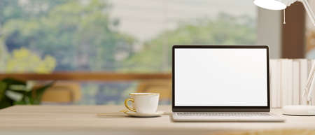 Close-up, laptop blank screen mockup on table over blurred co-working space cafe in the background. 3d rendering, 3d illustrationの写真素材