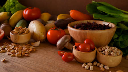 Close-up of various healthy raw organic vegetables for vegetarian, rice berry, nuts, vegetables....