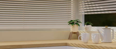 Close-up Modern light wooden kitchen countertop with a white ceramic tea sets, decor and space for montage. 3d rendering, 3d illustration.の写真素材