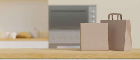 Close-up wooden tabletop with montage space and shopping paper bags mockup over blurred home kitchen in the background. 3d rendering, 3d illustrationの写真素材