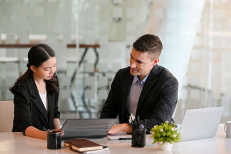 Businessman consulting and planning the meeting subjects for business boards conference with his assistant.の写真素材