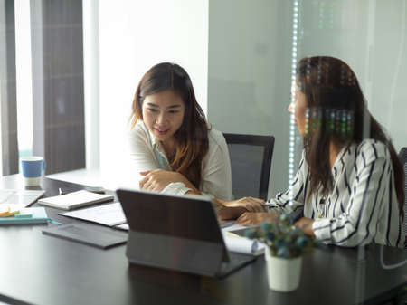 Business female colleague worker enjoy working together in conference room. businesspeople concept.の写真素材