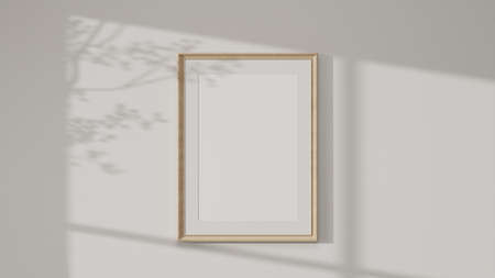 Minimal wooden picture poster frame mockup on white wallpaper with soft  shadows. 3d rendering, 3d illustrationの写真素材
