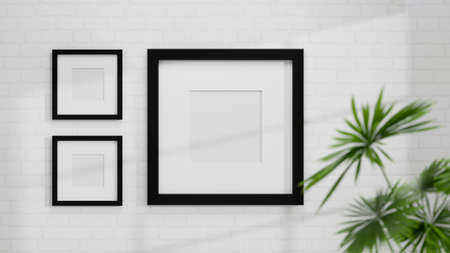 Modern black photo frames mockup on white brick wall with house plant for home interior. 3d rendering, 3d illustrationの写真素材
