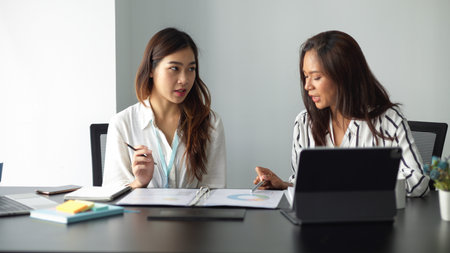 Female business worker in social media team planning works together in meeting room in the office.の写真素材