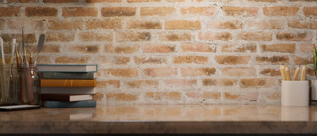 Vintage marble working table with painting tools, books and empty space for montage over brick wall background. 3d rendering, 3d illustrationの写真素材