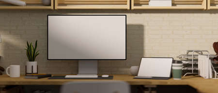 Modern and wooden cozy home workplace with computer mockup, Digital tablet mockup and office supplies. 3d rendering, 3d illustrationの写真素材