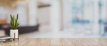 Close-up of mock-up space for montage product display on wooden tabletop with books and indoor plant over blurred office background. 3d rendering, 3d illustrationの写真素材