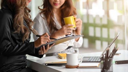 Cropped image of two confident business partners meeting and discussing business collaboration.