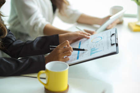 Cropped image of Financial investor analyse and look at financial statement report in the meeting.の写真素材
