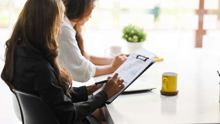 The female accountant manager joined the meeting to present financial cash flow to board members.の写真素材