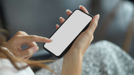 People and technology concept. Close-up female hands using mobile applications via modern mobile...