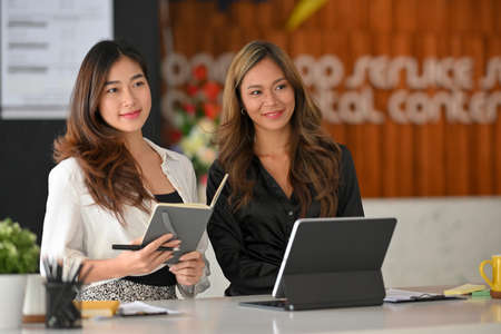 Friendly female HR manager, job interviewer are interviewing job candidates in conference room.の写真素材