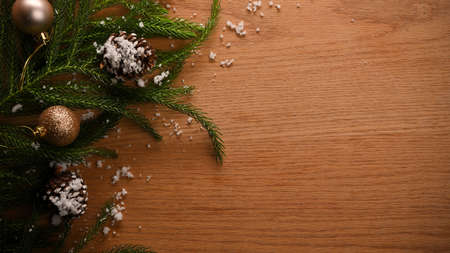 Christmas holiday background with Christmas tree and copy space on wooden background. top view, flat lay.の写真素材