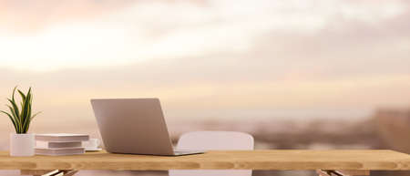 Laptop computer and mockup space for montage on wooden table over blurred beautiful view in background. 3d rendering, 3d illustrationの写真素材