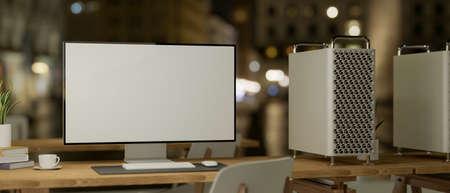 Modern pc computer with white screen mockup on wooden table in office studio at night. 3d rendering, 3d illustrationの写真素材