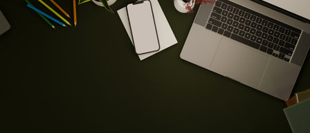 Top view of a modern desk with laptop computer, smartphone, stationery and copy space on black background. 3d rendering, 3d illustrationの写真素材