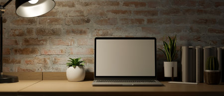 Modern vintage workspace with laptop computer mockup and accessories on wooden table over brick wall. 3d rendering, 3d illustrationの写真素材