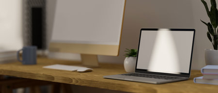 Close-up, Workplace with laptop computer, desktop computer mockup and accessories. 3d rendering, 3d illustrationの写真素材