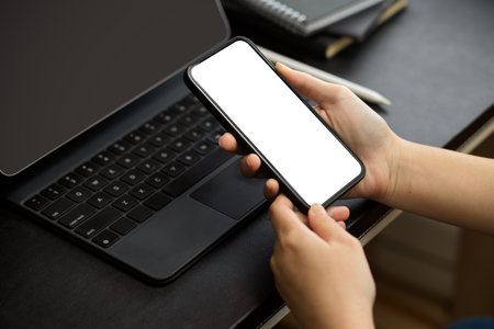 A woman browsing internet, searching some informations on the internet via smartphone. phone blank screen. close-upの写真素材