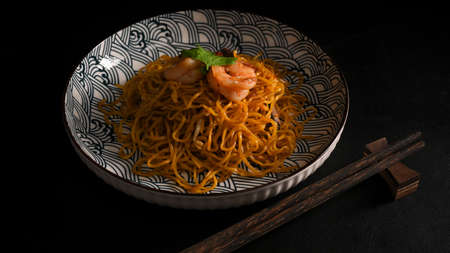 Chinese stir fried noodle with shrimp, Chow mein, Schezwan noodles, Chinese cuisine concept.の写真素材