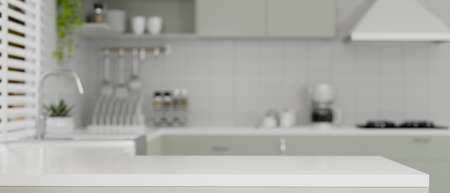 Modern kitchen island with copy space for product display over blurred modern kitchen cooking space interior on the background. 3d rendering, 3d illustrationの写真素材