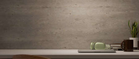 Modern loft workspace with laptop computer, headphone, coffee cup, accessories and copy space for...