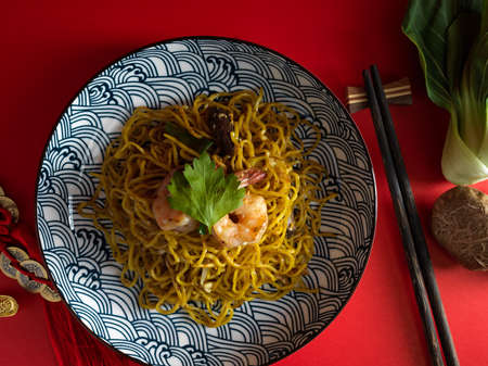 Top view, Overhead view, Above view of a tasty chow mein noodles or Chinese stir fried noodles on a plate.の写真素材