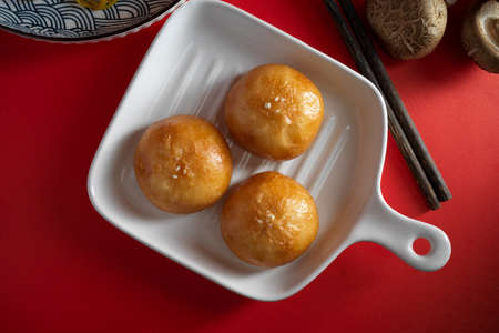 Close-up, top view, Chinese deep fried buns on a white plate. Asian street food concept. Chinese dessert.の写真素材