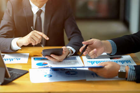 Close-up a Professional businessman talking and meeting with his financial management worker in the office.の写真素材
