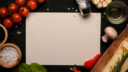 A blank paper for display your text or graphic with organic fresh vegetables, seasoning and butter. Food recipe template. Top viewの写真素材