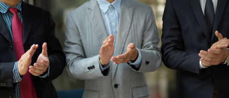 Successful executive manager or businessmen in formal suit clapping their hands in the meeting....