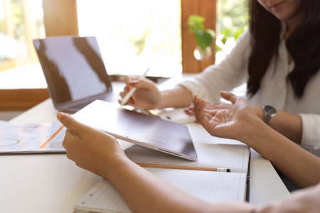 Business colleagues discussing and sharing their business ideas for plan a new business campaigning the office.の写真素材