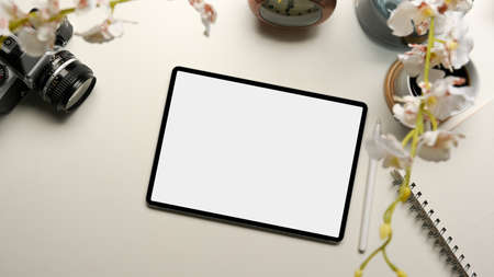 Modern digital tablet computer white display for your graphic on modern white worktable. top viewの写真素材