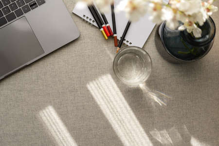 Top view of a comfortable workspace with laptop computer, decor and copy space on table.の写真素材
