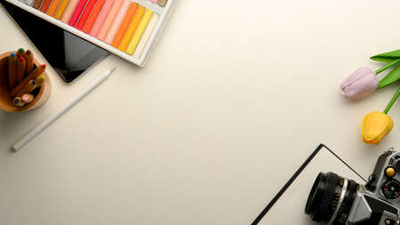 Freelance photographer office desk with work tools, camera and copy space for your texts. top viewの写真素材