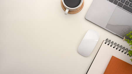 Simple office workspace with notebook laptop, notepads, wireless mouse, coffee cup and copy space on white background. top viewの写真素材