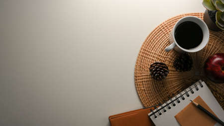 A copy space for product display on white background with stationery, coffee mug and decor. top viewの写真素材