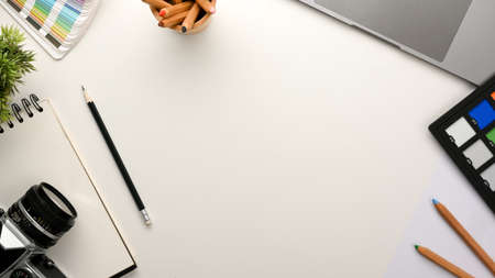 Photographer, graphic designer or photo editor workspace with copy space on white background. top viewの写真素材