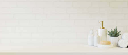 Marble ceramic white lotion bottles, soap, towels and plant in a pot with copy space for your product display over white bathroom wall background. 3d rendering, 3d illustrationの写真素材
