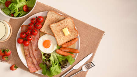 Top view of a healthy breakfast set with copy space on dining table. salad bowl, milk and breakfast.の写真素材