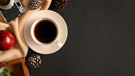 Modern black background with coffee cup, decorations and copy space for display your menu. top viewの写真素材