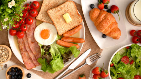 Healthy and fresh breakfast serving on dining table. Balanced diet breakfast set. Yummy hotel breakfast set. top viewの写真素材