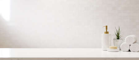 Set of modern minimal bath accessories on white countertop over white background. shampoo bottle, soap, towels and copy space. 3d rendering, 3d illustrationの写真素材